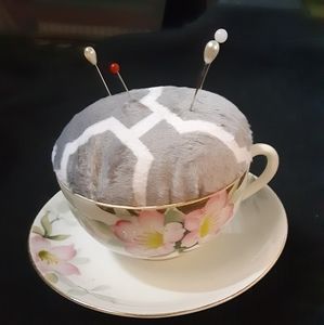 Gray tea cup pin cushion
